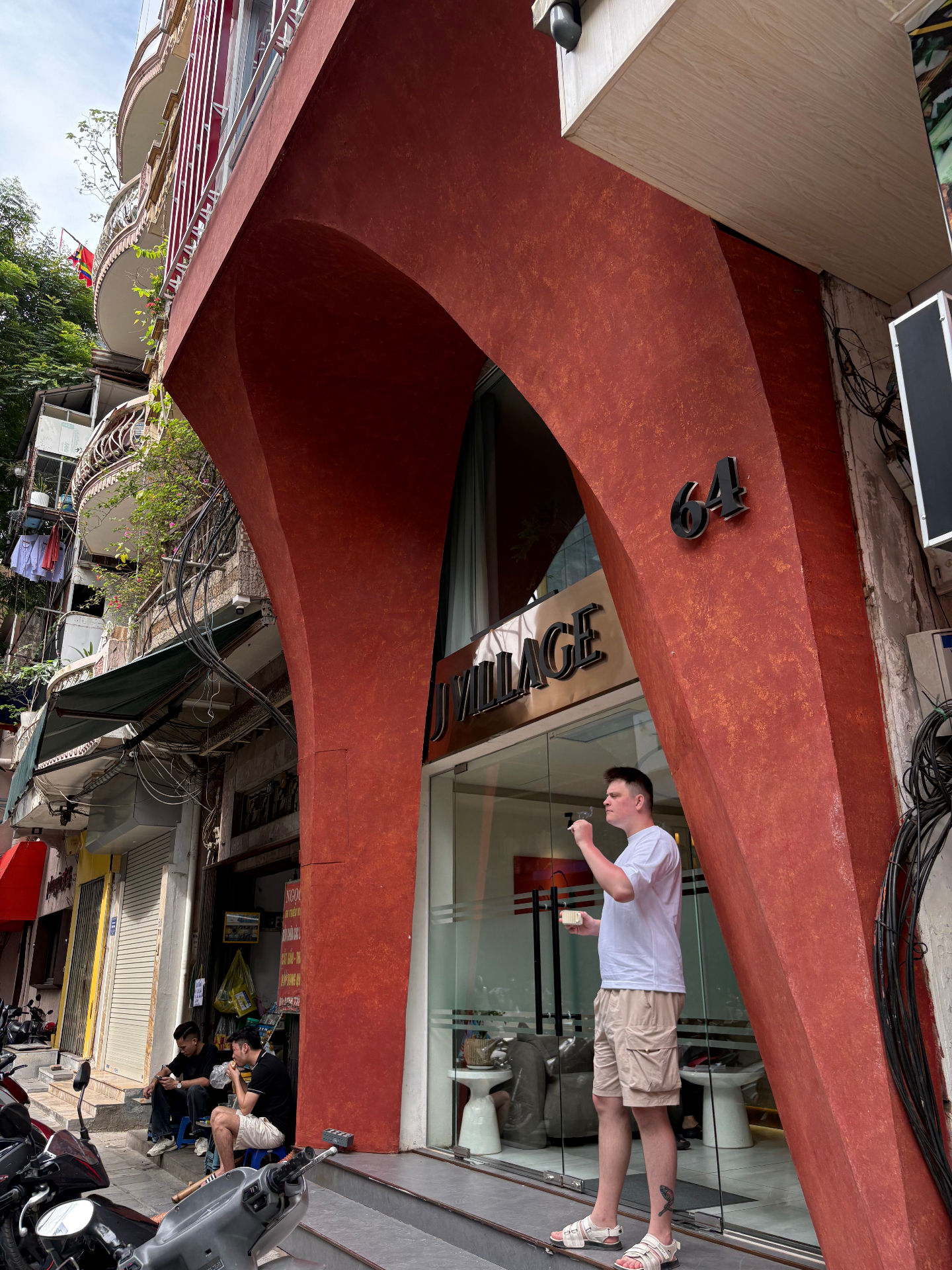 J Village Hotel terracotta arched facade